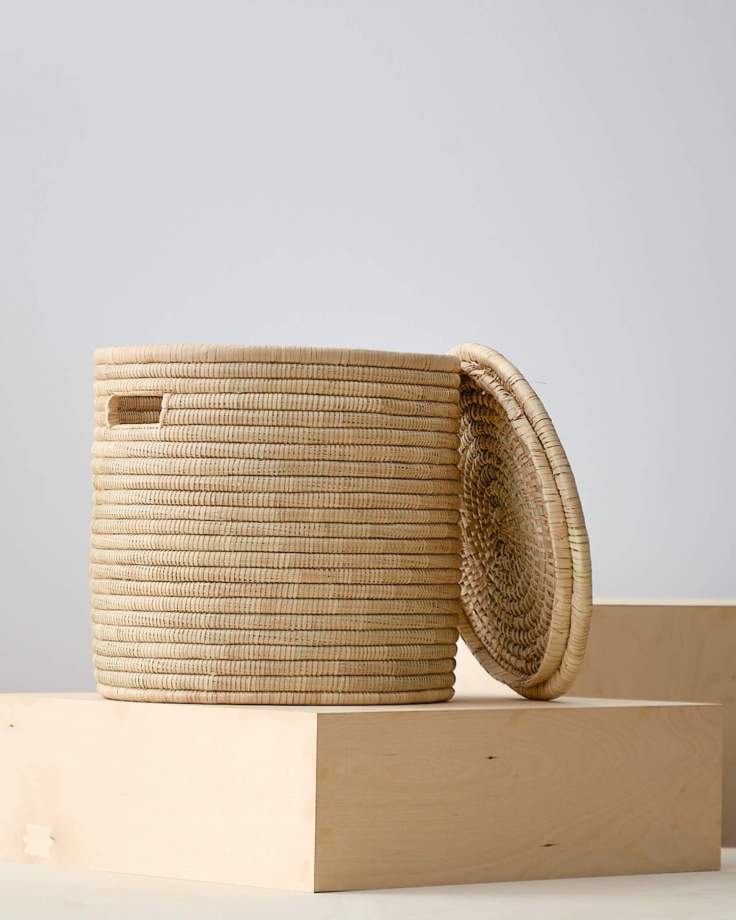 
                  
                    Small lidded Salima storage basket by Fairkind.
                  
                