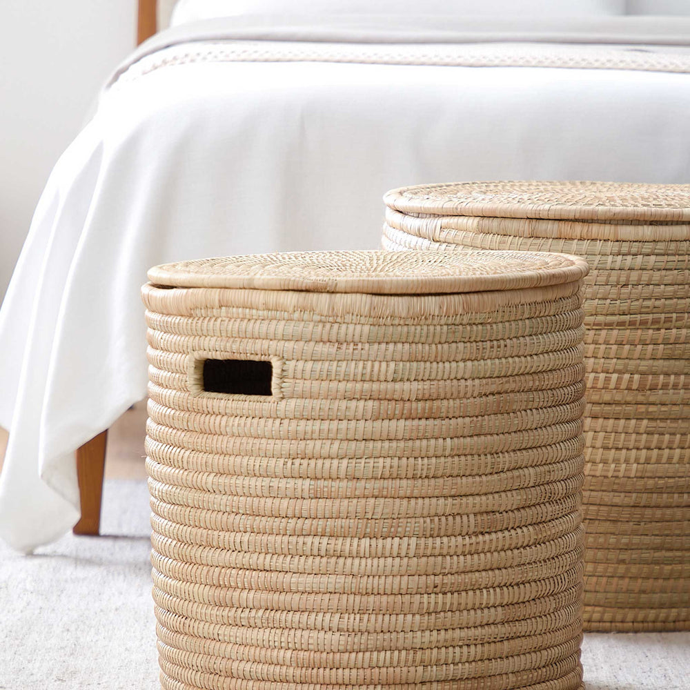 
                  
                    Handwoven storage baskets at foot of bed. Salima baskets by Fairkind.
                  
                