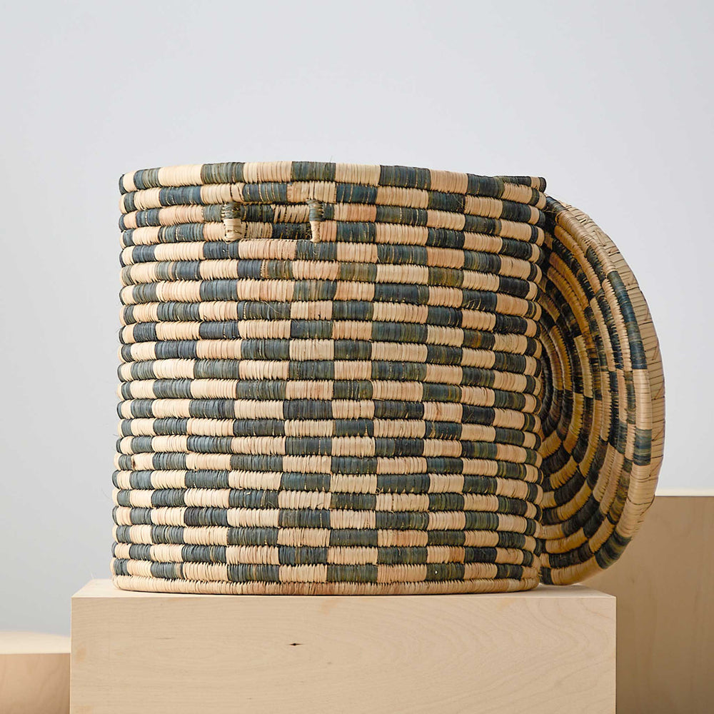 
                  
                    Large lidded checkered laundry basket. Handmade in Malawi.
                  
                