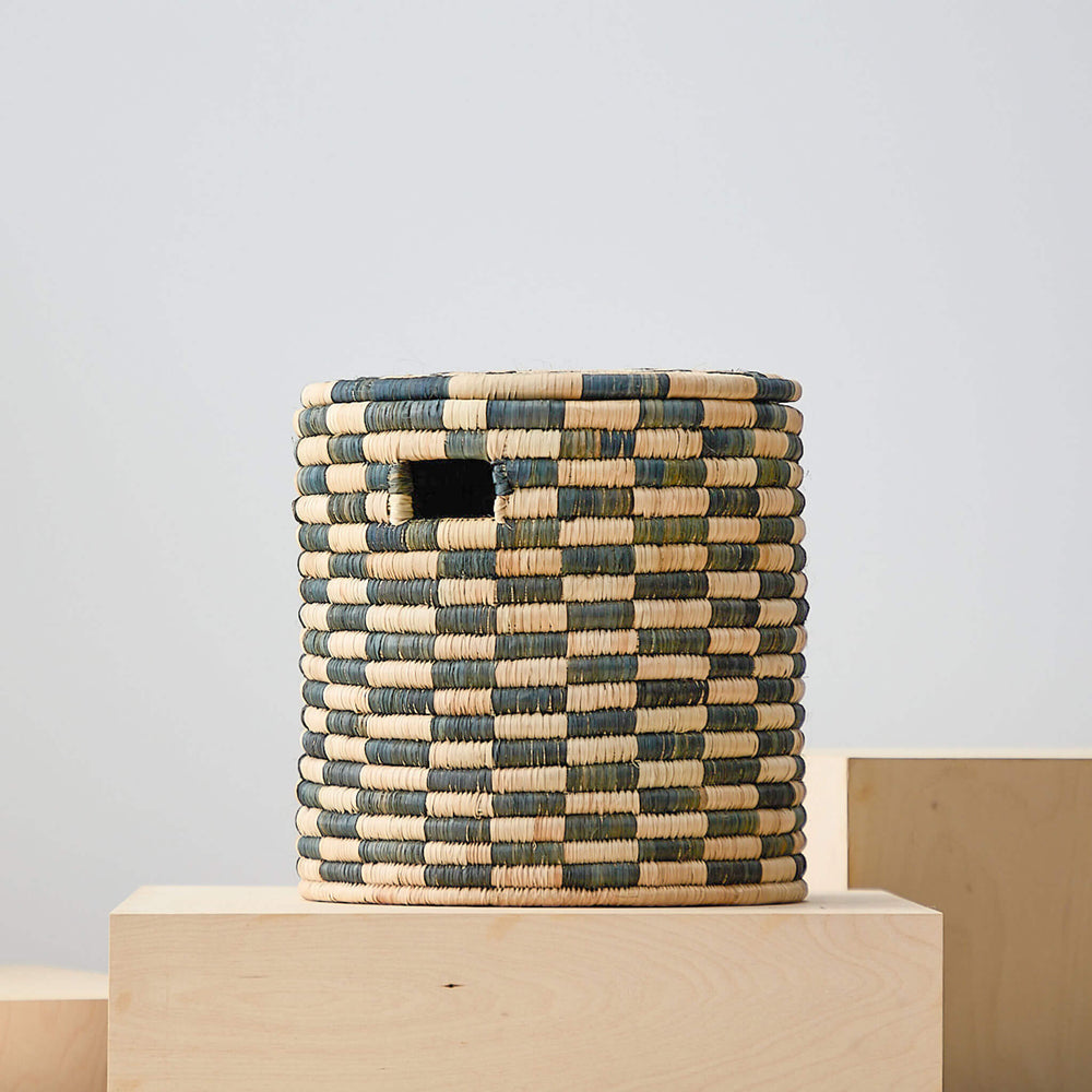
                  
                    Small checkered lidded storage basket. Azibo Storage Baskets by Fairkind.
                  
                