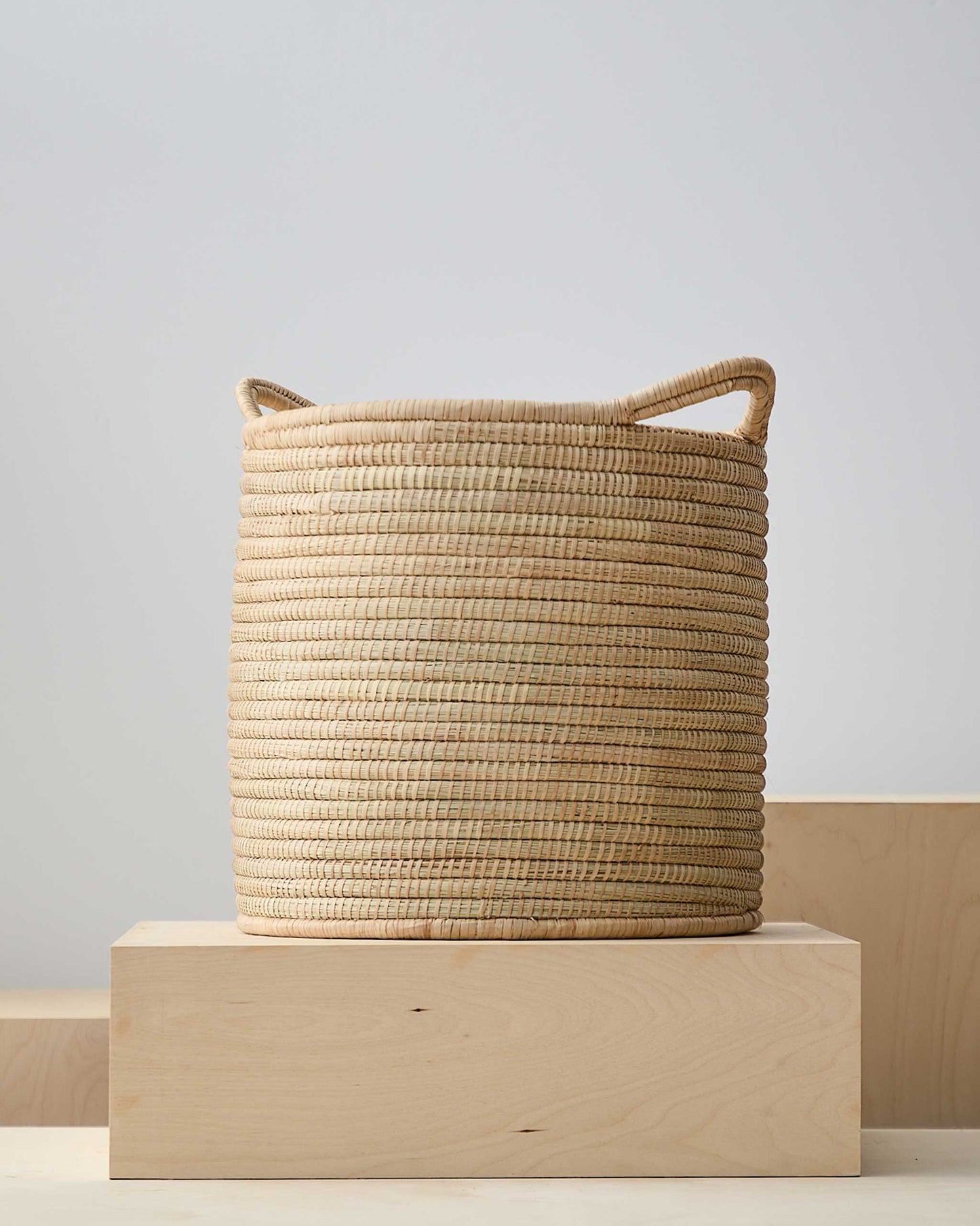 
                  
                    Large Ilala palm storage basket with handles. Luka Storage Baskets by Fairkind.
                  
                