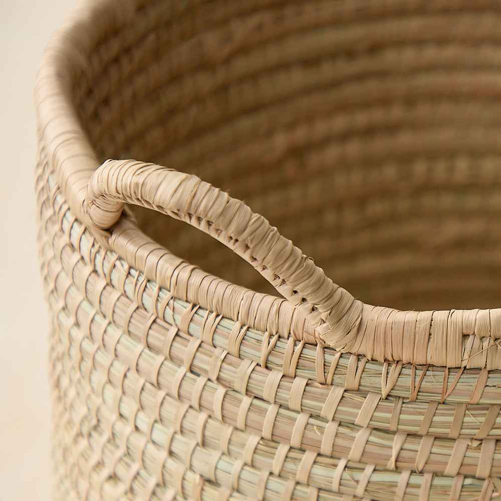 
                  
                    Detail of Luka Storage Basket. Open basket with handles.
                  
                