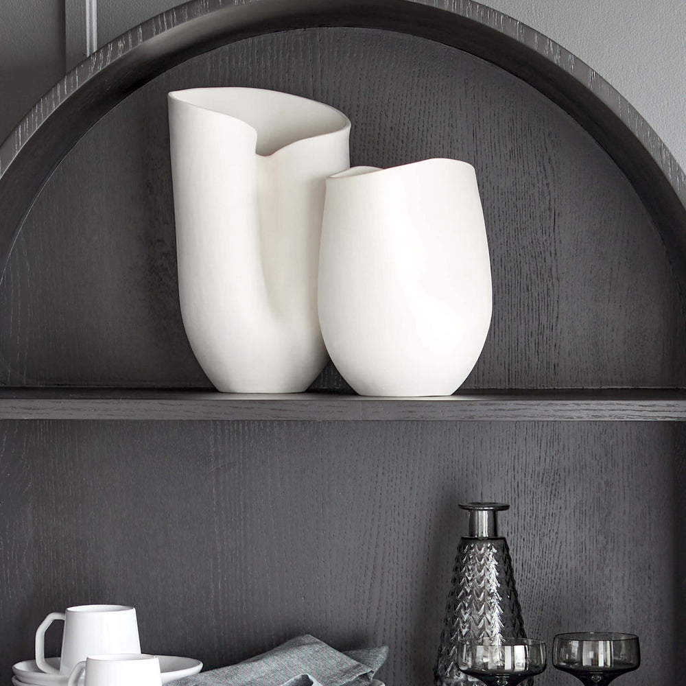 
                  
                    Large and Medium Zoya Vases styled on the top shelf of a modern black hutch. Part of Fairkind's Morocco Ceramic Collection.
                  
                