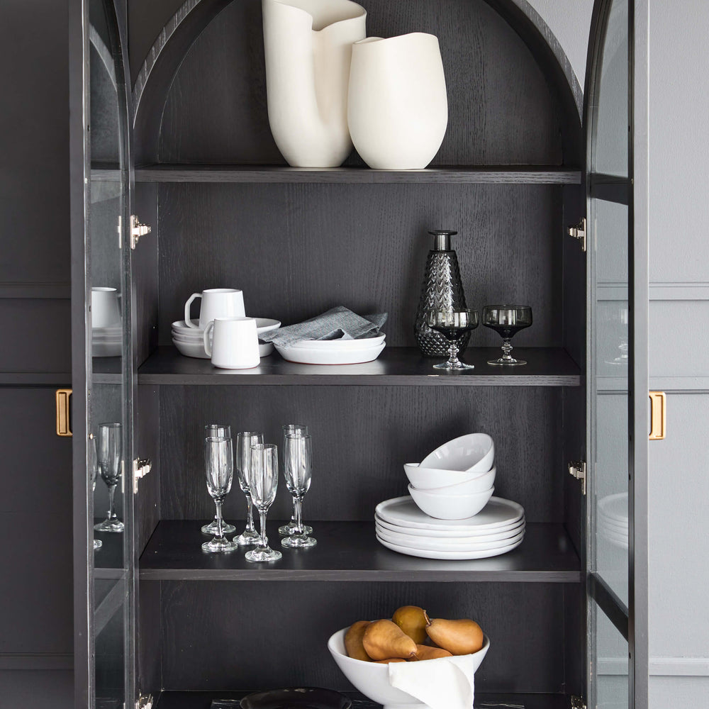 
                  
                    Handcrafted ceramics from Morocco in modern, black hutch.
                  
                