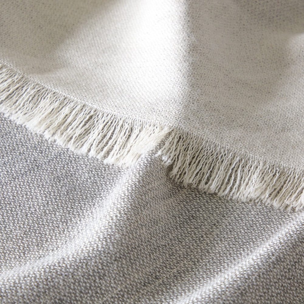 Fringe detail of Soñando gray handwoven baby alpaca throw ethically sourced and limited edition gift.