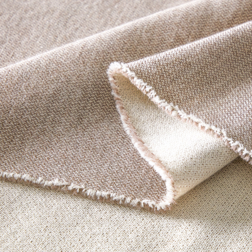 
                  
                    Edge detail of Fairkind sand baby alpaca throw hand-loomed by artisans in Peru.
                  
                